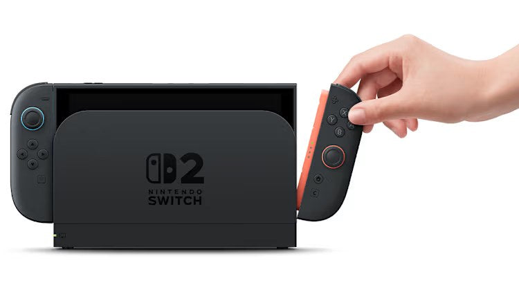 Hand detaching the right Joy-Con 2 from a docked Nintendo Switch 2